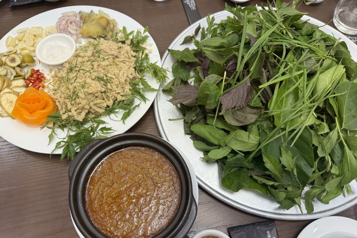 Raw fish salad with herbs, starfruit, and dipping sauce in Kim Son
